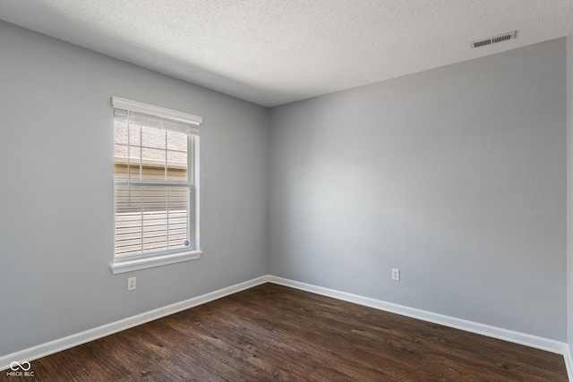 4136 Orchard Valley Ln, Indianapolis, IN 46235 - empty room with dark wood finished floors, baseboards, and a textured ceiling
