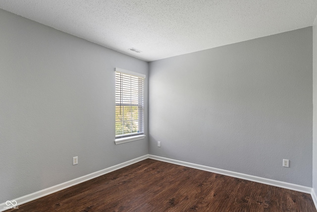 4136 Orchard Valley Ln, Indianapolis, IN 46235 - spare room with dark wood-style flooring, baseboards, and a textured ceiling