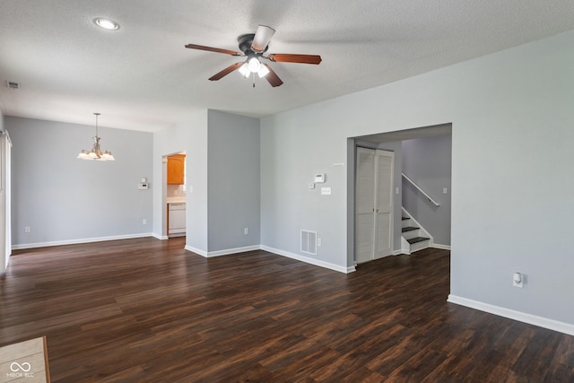 4136 Orchard Valley Ln, Indianapolis, IN 46235 - empty room featuring a chandelier, ceiling fan, stairway, dark wood-type flooring, and baseboards