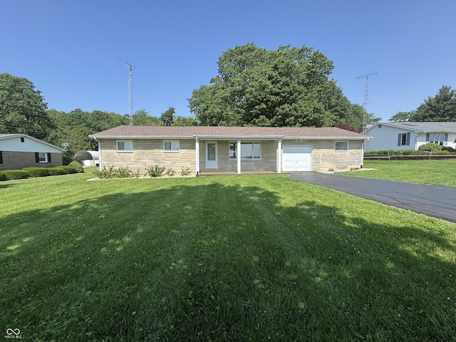 1314 E Orange Pike, Rushville, IN 46173 - ranch-style house with a garage, driveway, a front yard, and stone siding