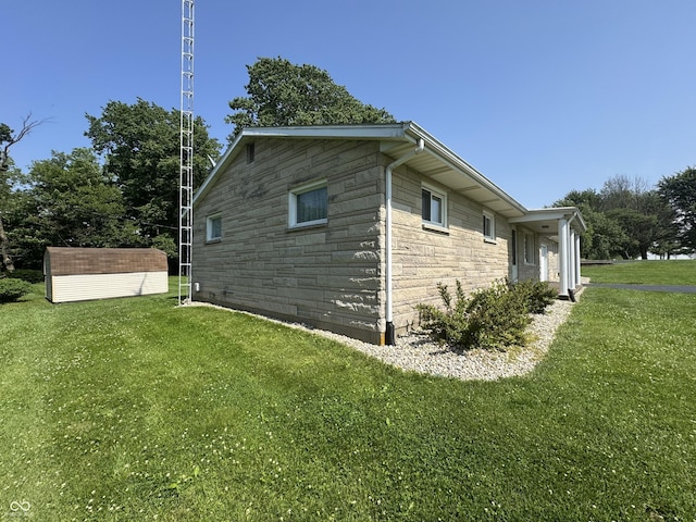 1314 E Orange Pike, Rushville, IN 46173 - view of home's exterior featuring a yard, a storage unit, and stone siding