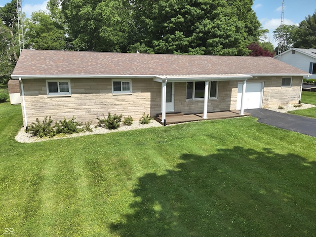 1314 E Orange Pike, Rushville, IN 46173 - ranch-style house featuring stone siding, a garage, and a front yard