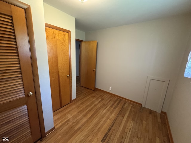 1314 E Orange Pike, Rushville, IN 46173 - unfurnished bedroom with light wood-style floors