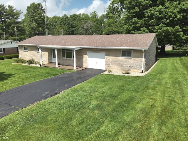 1314 E Orange Pike, Rushville, IN 46173 - single story home with stone siding, an attached garage, driveway, covered porch, and a front lawn