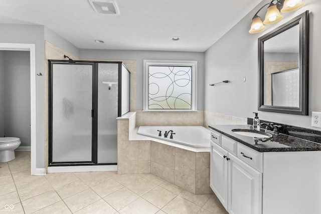 bathroom with tile patterned floors, a shower stall, vanity, and a garden tub