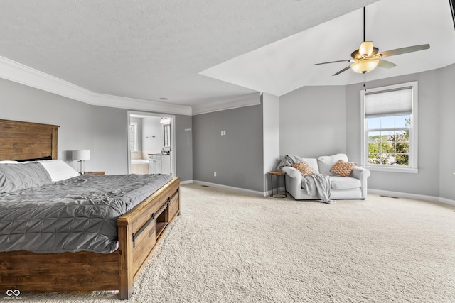 bedroom featuring baseboards, carpet, ornamental molding, ensuite bathroom, and a ceiling fan