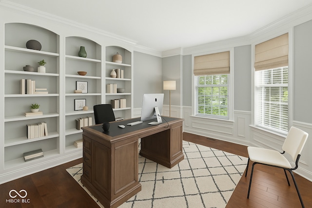 office space with light wood-style flooring, built in shelves, a wainscoted wall, and crown molding