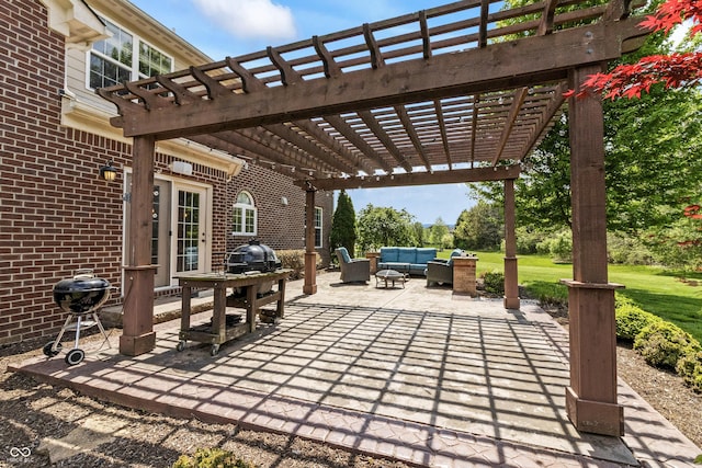 view of patio featuring outdoor lounge area, a pergola, and grilling area