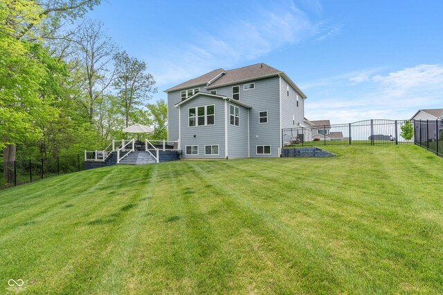 back of house featuring a wooden deck