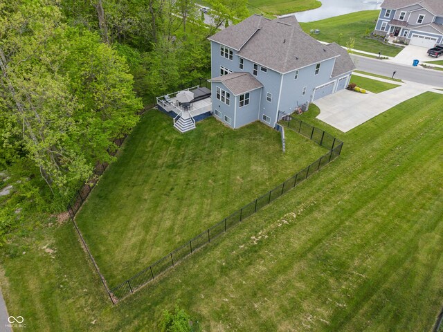 aerial view of property and surrounding area with a large body of water