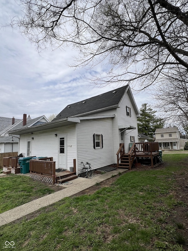 rear view of house featuring a deck