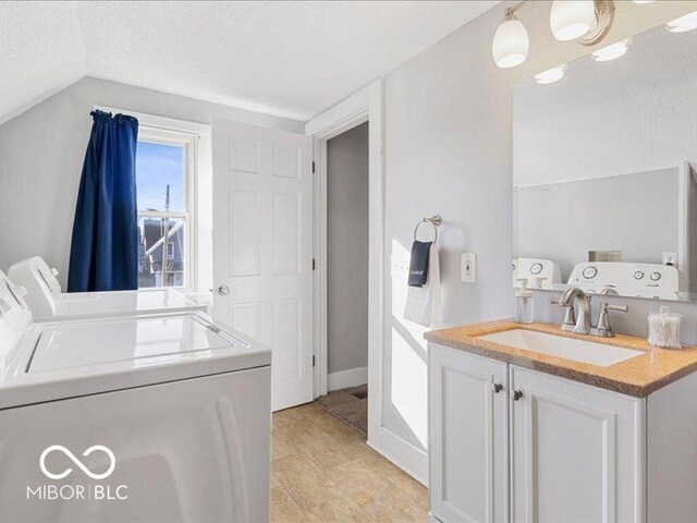 923 S State Ave, Indianapolis, IN 46203 - laundry room with independent washer and dryer and a textured ceiling
