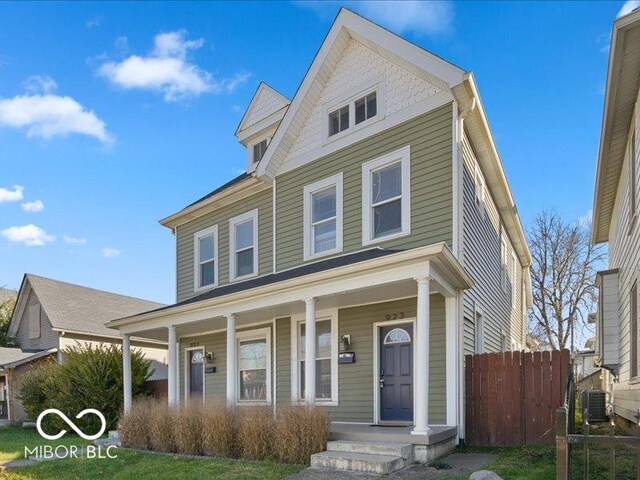 923 S State Ave, Indianapolis, IN 46203 - view of front of property with a porch, cooling unit, and fence