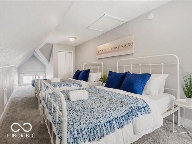 923 S State Ave, Indianapolis, IN 46203 - carpeted bedroom featuring attic access, baseboards, a closet, and vaulted ceiling