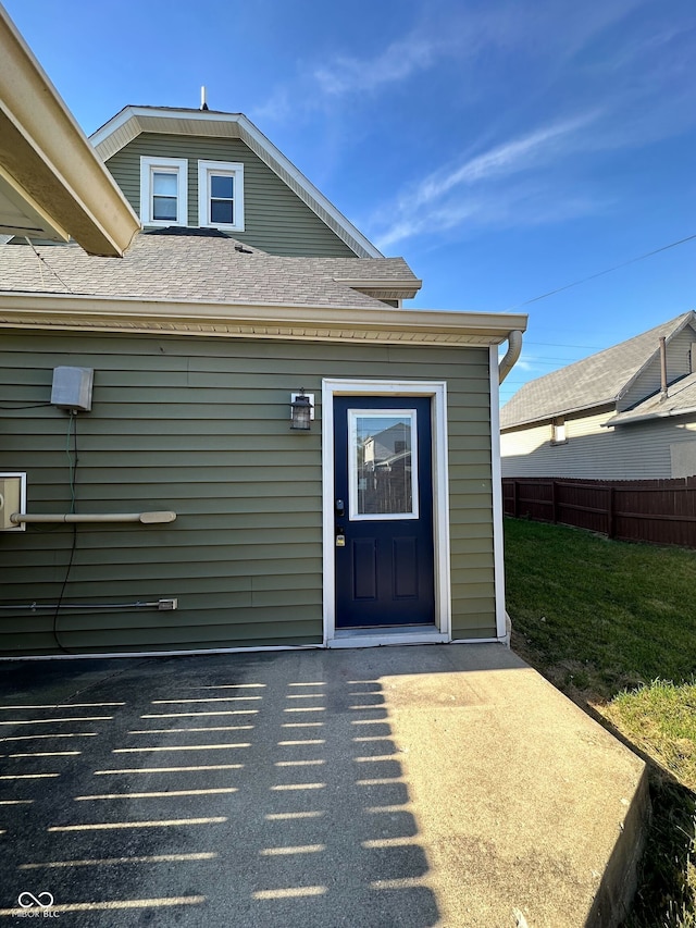 923 S State Ave, Indianapolis, IN 46203 - property entrance featuring fence and roof with shingles