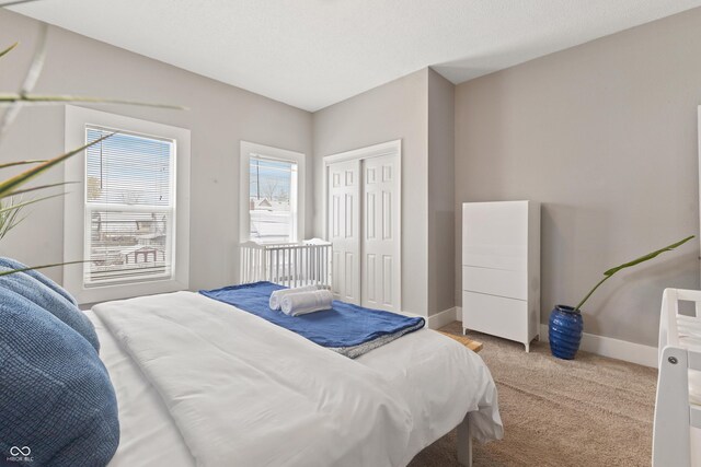 923 S State Ave, Indianapolis, IN 46203 - bedroom featuring light carpet, baseboards, and a closet