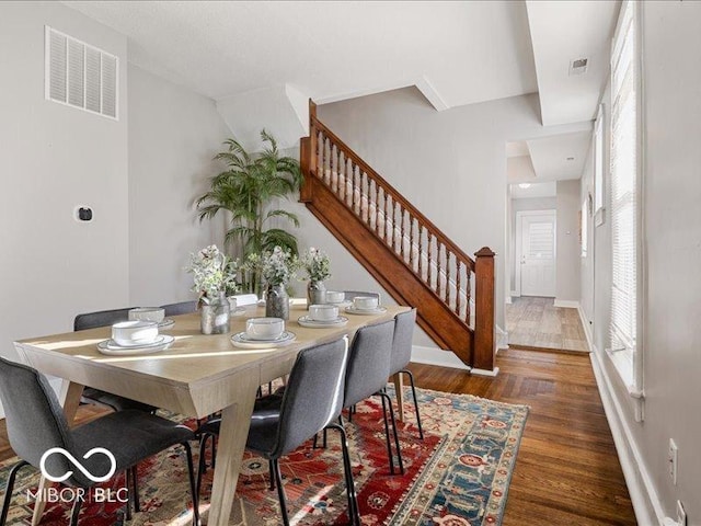 923 S State Ave, Indianapolis, IN 46203 - dining room with stairs, wood finished floors, and baseboards