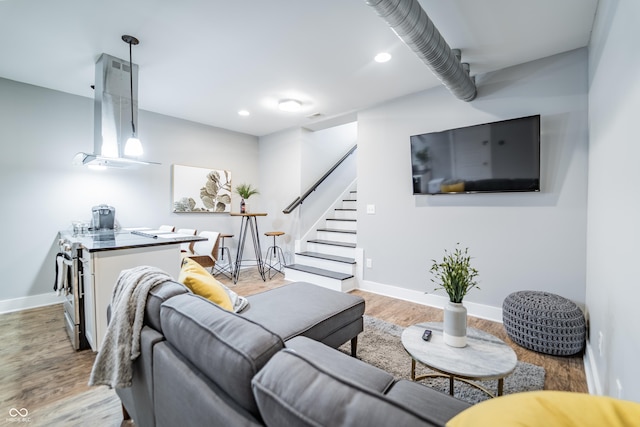 1112 Spann Ave, Indianapolis, IN 46203 - living area featuring wood finished floors, stairway, baseboards, and recessed lighting