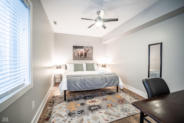 1112 Spann Ave, Indianapolis, IN 46203 - bedroom featuring baseboards, wood finished floors, and a ceiling fan