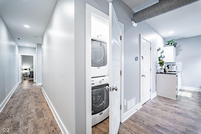 1112 Spann Ave, Indianapolis, IN 46203 - corridor featuring estacked washer and dryer, wood finished floors, baseboards, and recessed lighting