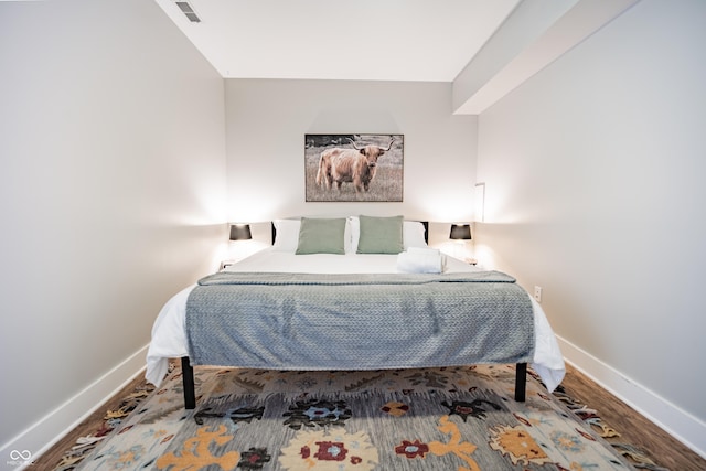 1112 Spann Ave, Indianapolis, IN 46203 - bedroom featuring baseboards and wood finished floors