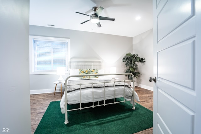 1112 Spann Ave, Indianapolis, IN 46203 - bedroom featuring wood finished floors, baseboards, and a ceiling fan