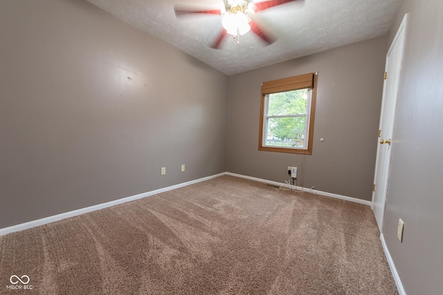 980 Red Maple Ct, Greenwood, IN 46143 - unfurnished room with a textured ceiling, carpet floors, a ceiling fan, and baseboards