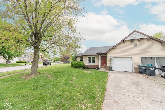 980 Red Maple Ct, Greenwood, IN 46143 - ranch-style home featuring concrete driveway, an attached garage, brick siding, and a front yard