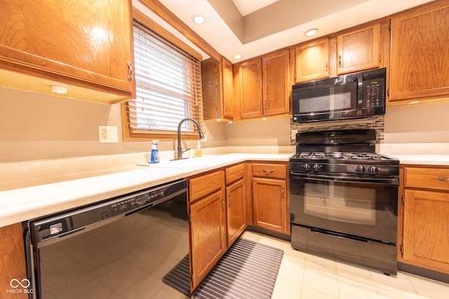 980 Red Maple Ct, Greenwood, IN 46143 - kitchen with recessed lighting, light countertops, black appliances, and a sink