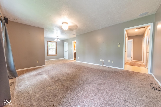 980 Red Maple Ct, Greenwood, IN 46143 - carpeted spare room with a textured ceiling and baseboards