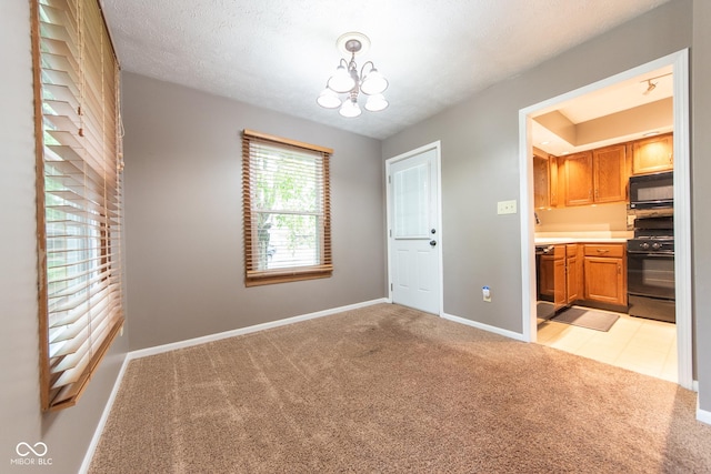 980 Red Maple Ct, Greenwood, IN 46143 - unfurnished dining area featuring baseboards, light carpet, and an inviting chandelier