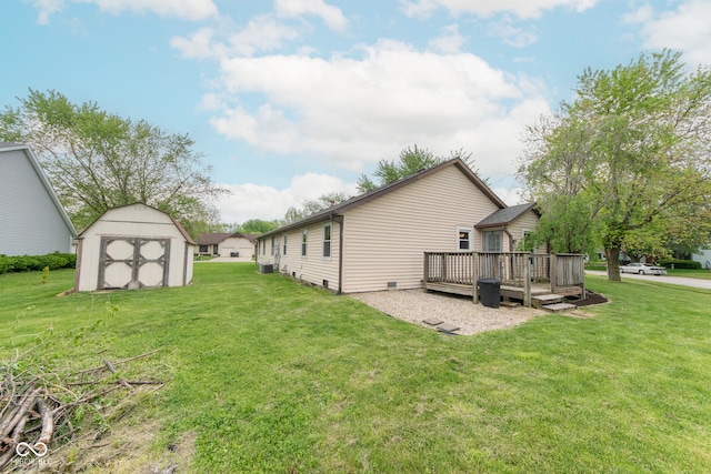 980 Red Maple Ct, Greenwood, IN 46143 - view of property exterior with a lawn, a storage shed, an outdoor structure, and a deck