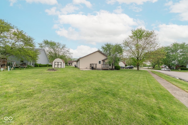 980 Red Maple Ct, Greenwood, IN 46143 - view of yard featuring an outbuilding, a wooden deck, and a shed