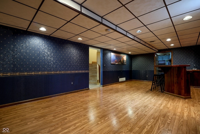 welcome area featuring wallpapered walls, a dry bar, and recessed lighting