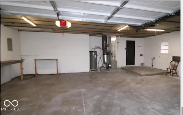 garage featuring electric panel, water heater, a garage door opener, and heating unit