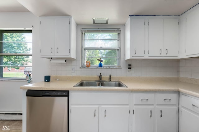 kitchen featuring dishwasher, a sink, a baseboard heating unit, and light countertops