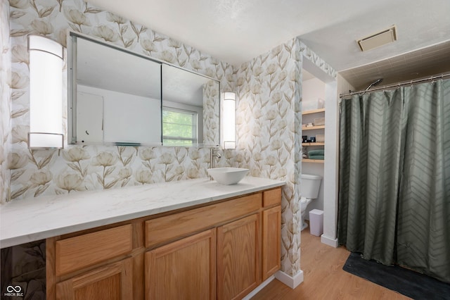 full bathroom featuring wood finished floors, vanity, toilet, decorative backsplash, and a shower with shower curtain