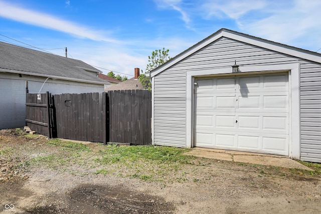 garage with fence