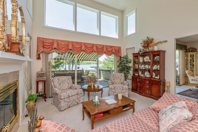 889 E N Shore Dr, Brownstown, IN 47220 - carpeted living room featuring a towering ceiling and a high end fireplace