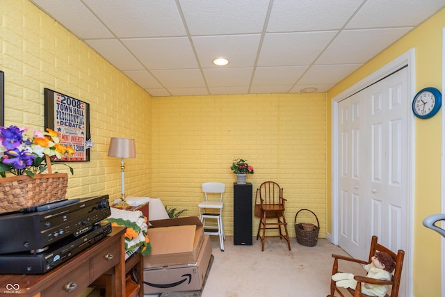 889 E N Shore Dr, Brownstown, IN 47220 - office area featuring brick wall, a drop ceiling, and carpet flooring