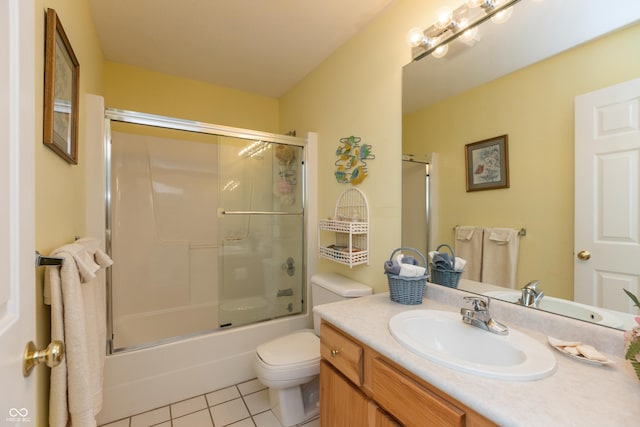 889 E N Shore Dr, Brownstown, IN 47220 - bathroom featuring tile patterned floors, toilet, vanity, and enclosed tub / shower combo