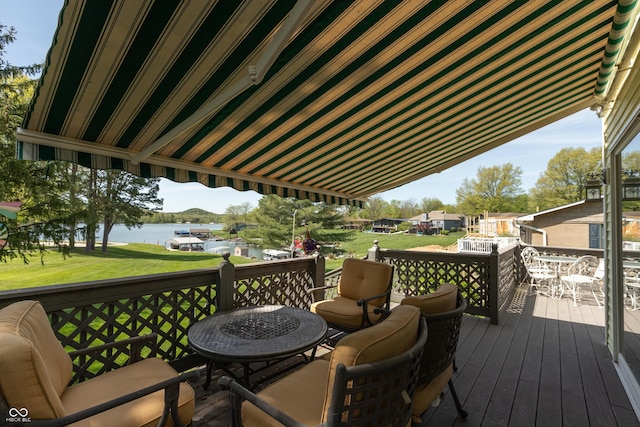 889 E N Shore Dr, Brownstown, IN 47220 - wooden terrace with a water view, outdoor dining area, and a yard