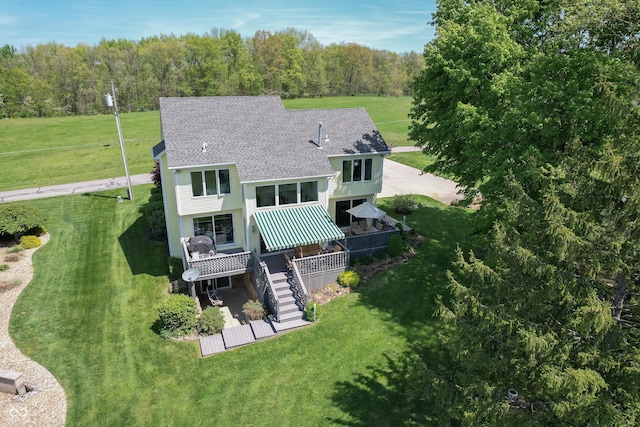 889 E N Shore Dr, Brownstown, IN 47220 - back of property featuring stairs, roof with shingles, a wooden deck, a lawn, and a view of trees