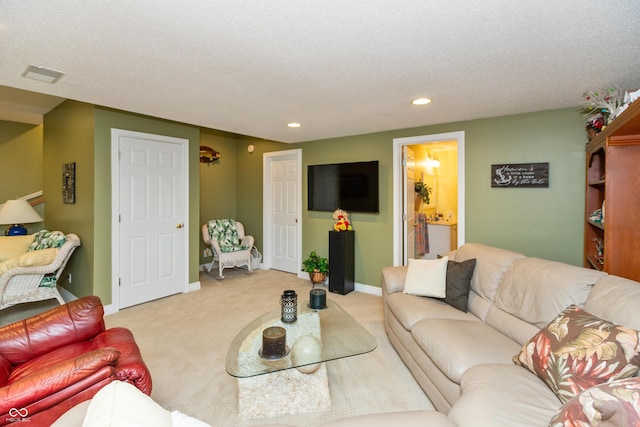 889 E N Shore Dr, Brownstown, IN 47220 - living room with recessed lighting, light carpet, a textured ceiling, and baseboards