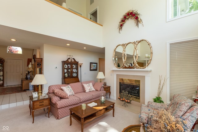 889 E N Shore Dr, Brownstown, IN 47220 - carpeted living room featuring a towering ceiling, a tile fireplace, and recessed lighting