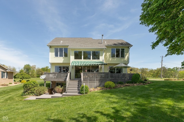 889 E N Shore Dr, Brownstown, IN 47220 - rear view of property featuring a deck, a lawn, and roof with shingles