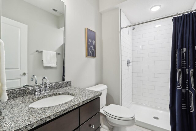 9155 Kerwood Dr, Indianapolis, IN 46240 - bathroom featuring toilet, vanity, and tiled shower