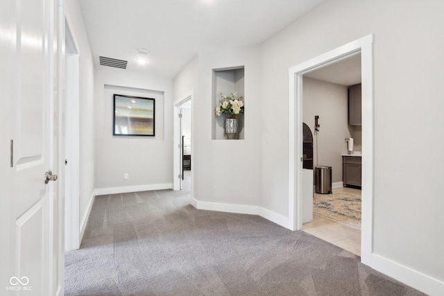 9155 Kerwood Dr, Indianapolis, IN 46240 - corridor with carpet floors and baseboards