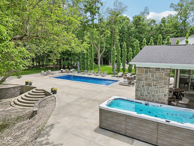 9155 Kerwood Dr, Indianapolis, IN 46240 - outdoor pool with an outdoor hot tub and a patio area
