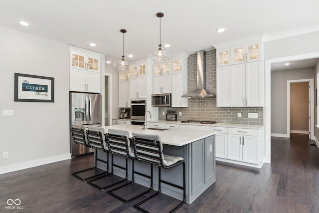 9155 Kerwood Dr, Indianapolis, IN 46240 - kitchen featuring wall chimney exhaust hood, stainless steel appliances, a sink, baseboards, and recessed lighting